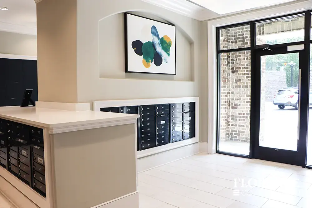 Recessed mount versatile™ 4C mailboxes in black installed in lobby mail room of multifamily apartment building