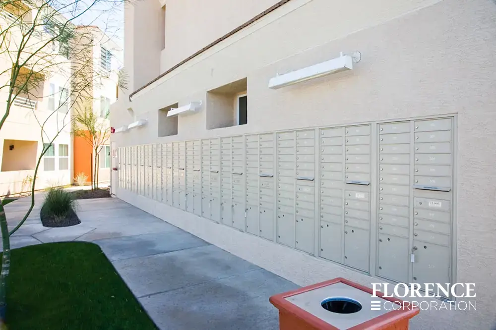 recessed mounted versatile™ 4C mailboxes in silver speck installed outdoors on exterior of multifamily apartment building
