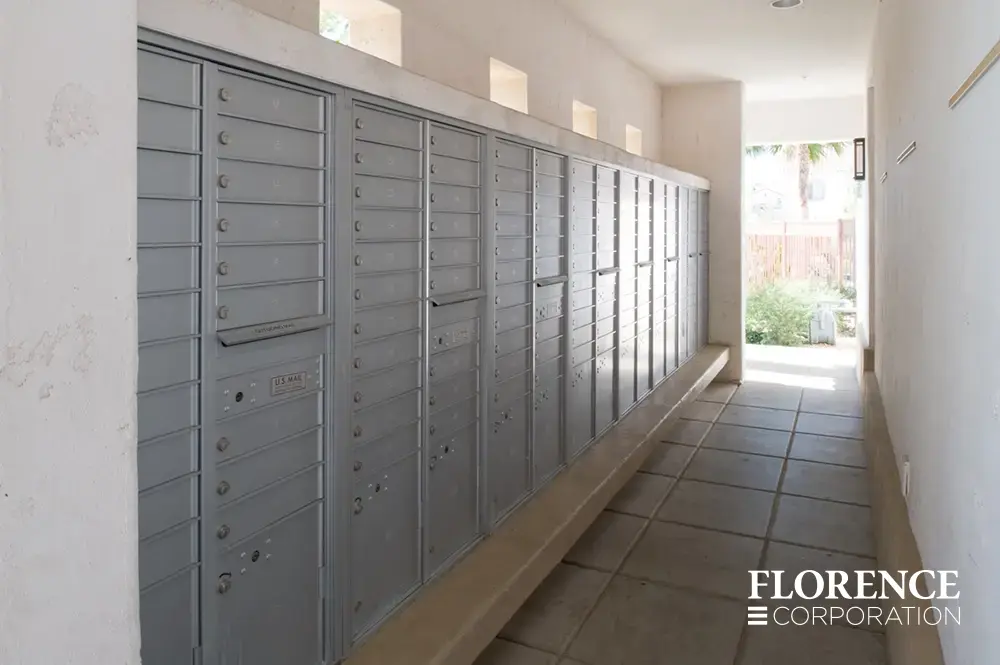 recessed mounted versatile™ 4C mailboxes in silver speck located in open air breezeway for multifamily pool area