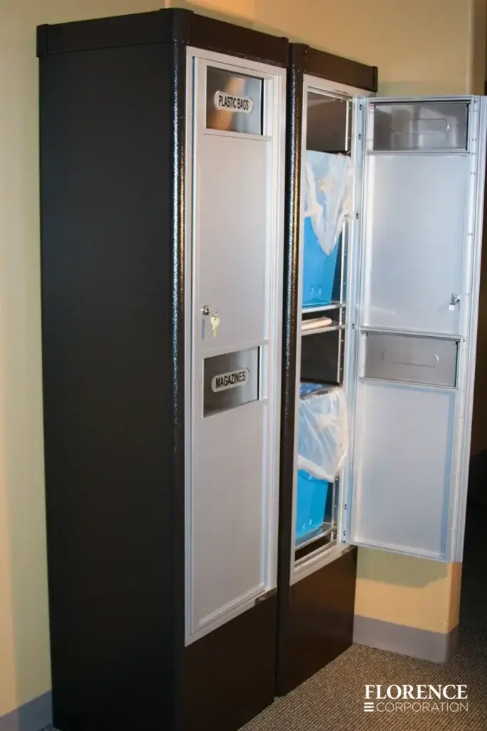 versatile™ 4C waste and recycling bins installed in black freestanding depot cabinets with door open revealing blue trash bins inside